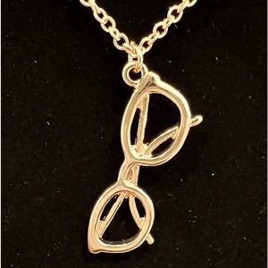 Necklace with “sunglasses or glasses”on gold tone chain. Fun piece or gift.